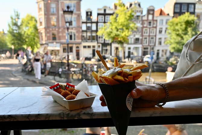 10 Tastes of Amsterdam: Food Tour by UNESCO Canals and Jordaan - Café Hegeraad, royal-palace glimpses, and the Nine Streets story walk