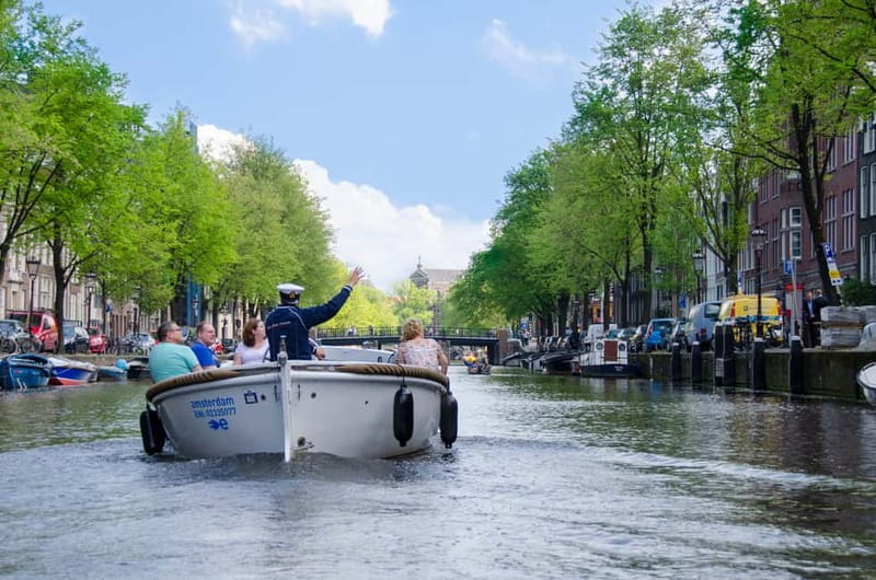 Amsterdam: 75 minute Open Boat Canal Cruise with Live Guide - The 75-minute route: what you’ll see from Westerkerk to the Amstel