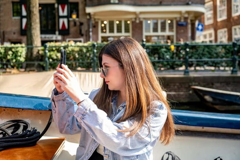 Amsterdam: 75 minute Open Boat Canal Cruise with Live Guide - Weather and comfort: the reality of an open deck