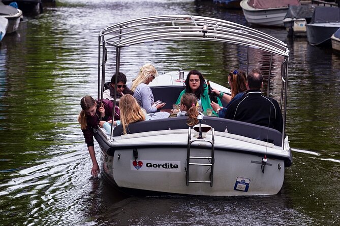 Amsterdam 90-min Private Canal Cruise with Live Guide and Drinks - The UNESCO Canal Belt: Merchant Houses and Golden Age Logic