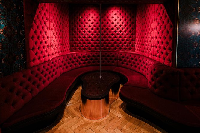 Amsterdam: Behind the Scenes Strip Club Tour with Ex-Sex Worker - Inside the Club: Rooms, VIP Areas, and the Lived-In Details