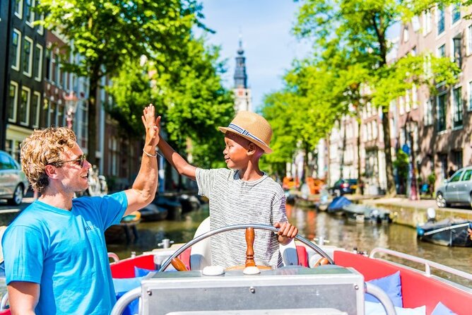 Amsterdam Canal Cruise in Open Boat with Unlimited Drinks Option - The boat setup: open viewing, glass top, and staying warm