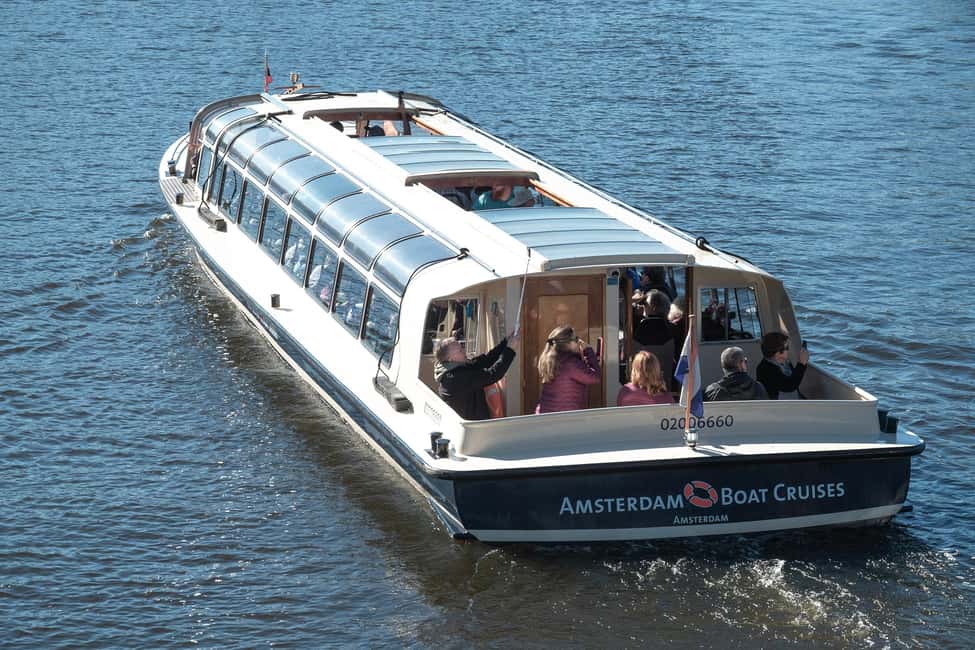 Amsterdam: Canal Cruise with Live Commentary & Audio Guide - Amstel and Binnenstad passages: spotting churches and the bridges