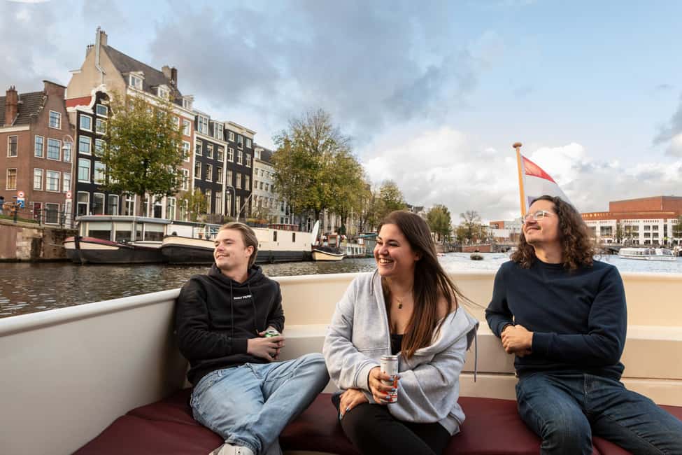 Amsterdam: Canal Cruise with Live Commentary & Audio Guide - Covered comfort, toilet onboard, and drinks for purchase