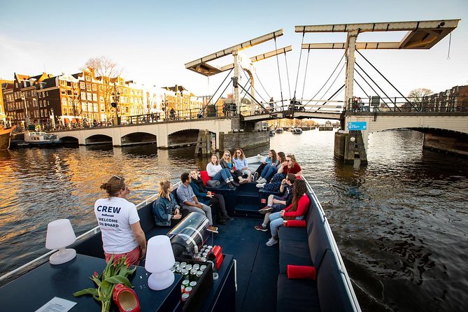 Amsterdam Canal Cruise With Live Guide and Unlimited Drinks - Jordaan + a coffeeshop stop vibe: neighborhoods with real character