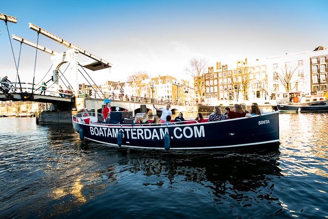 Amsterdam Canal Cruise With Live Guide and Unlimited Drinks - Cheese museums, towers, and landmark houses: the stops that make it fun