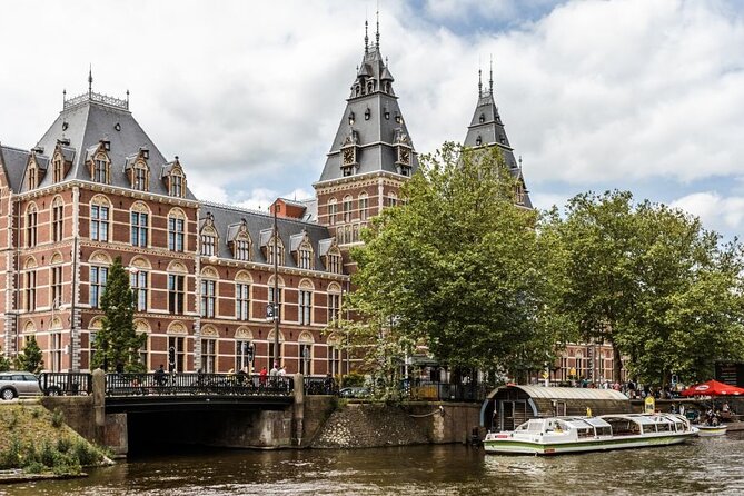 Amsterdam City Highlights and Hidden Gems - Private & Custom Tour - Market District Energy: Multicultural Flavor and Real-World Amsterdam