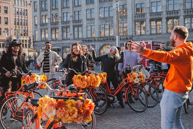 Amsterdam City Top Highlights Guided Bike Tour - Charming cafe streets, a pass near the Red Light District, and what to notice