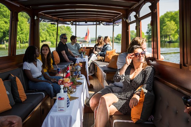 Amsterdam Classic Saloon Boat Cruise with Drinks and Cheese - Weather Reality: Bring Warm Layers, Trust the Cover