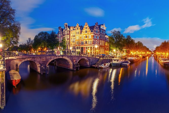Amsterdam Evening Canal Cruise with Live Guide and Onboard Bar - The Western Church and Canal Belt views you’ll actually remember