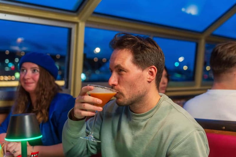 Amsterdam: Evening Cocktail Cruise along the canals - On board comfort: half open boat, blankets, Wi‑Fi, and a toilet