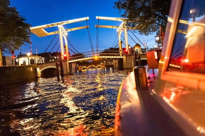 Amsterdam: Evening Cruise with Optional Wine and Snacks - On board: comfort, audio in 19 languages, and how the experience flows