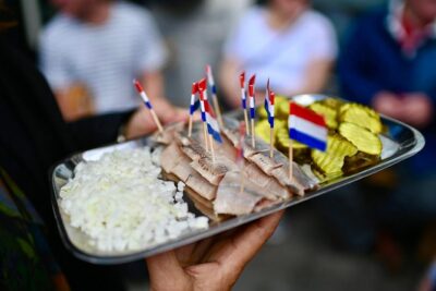 Amsterdam Food Tour of 10+ Local Classic Tastings in Jordaan Area - The Taste Lineup: Poffertjes, Cheese, Fish, and Dutch Comfort Food