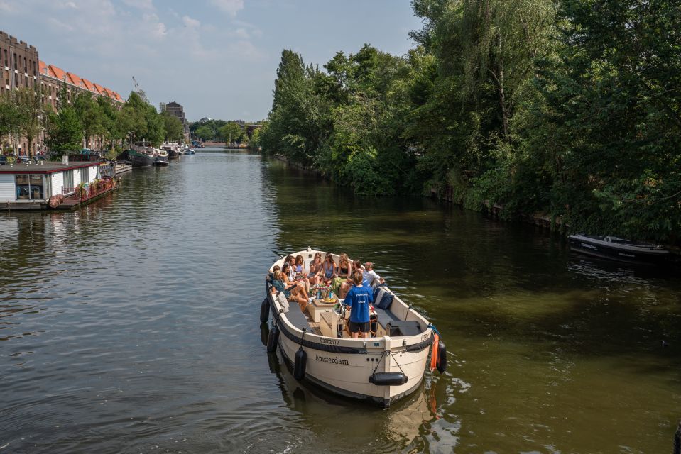 Amsterdam: German Guided Canal Cruise with on Board Bar - Stop-by-Stop: From Dancing Houses to Magere Brug