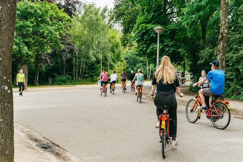 Amsterdam: Guided Bike Tour City Centre in EN/DE/FR/ES - Jordaan, De Negen Straatjes, and canal-side street culture