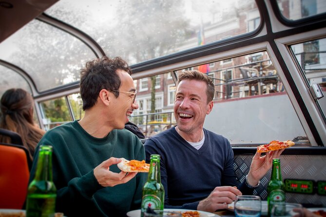 Amsterdam Guided Cruise with New York Pizza, Drinks and Ice Cream - The canal route at night: how each landmark changes the vibe