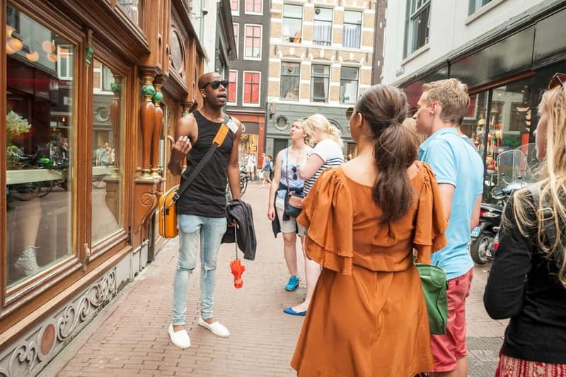 Amsterdam: Guided Ganja Walking Tour of Coffee Shops - University Library and Flower Market: culture stops that keep the walk real