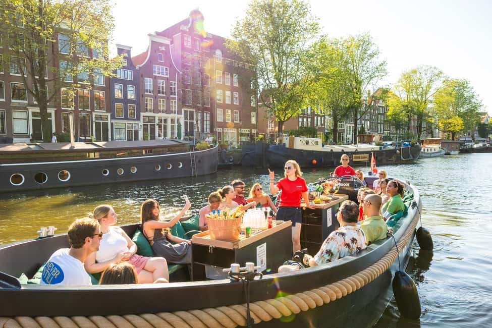 Amsterdam: Guided Open Boat Canal Cruise Including Drink - Meeting at Amsterdam Centraal: quick check-in, then you’re off