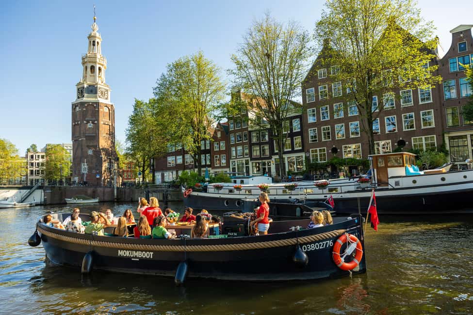 Amsterdam: Guided Open Boat Canal Cruise Including Drink - The route in order: 1 hour of photo stops and canal landmarks