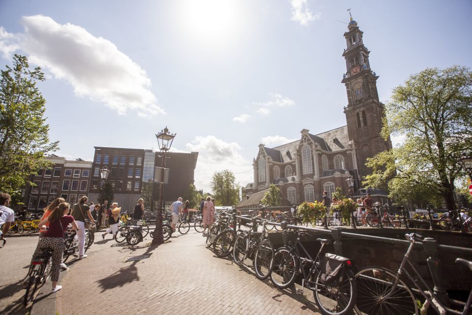 Amsterdam: Hidden Gems & Highlights Guided Bike Tour - Jordaan backstreets: courtyards, churches, and how canals shape the city