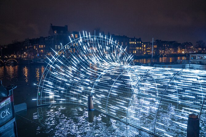 Amsterdam: Light Festival Cruise with Unlimited Drinks Option - Amstel River glide: the “slow down and look” part