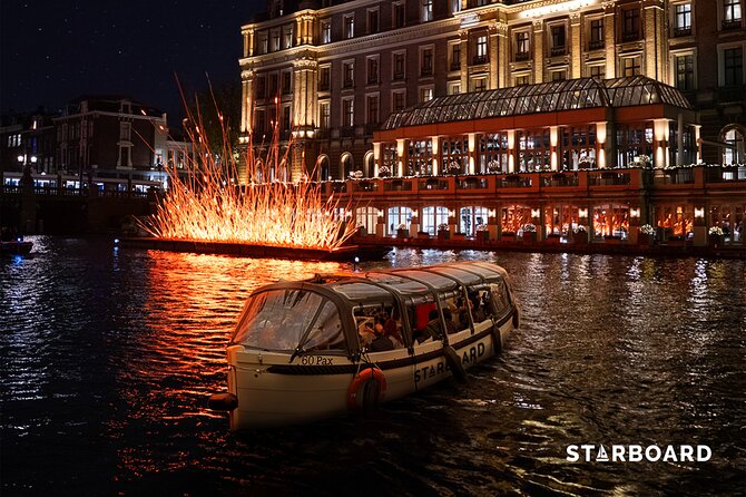 Amsterdam: Light Festival Cruise with Unlimited Drinks Option - Past the romantic bridge: classic Amsterdam scenes up close