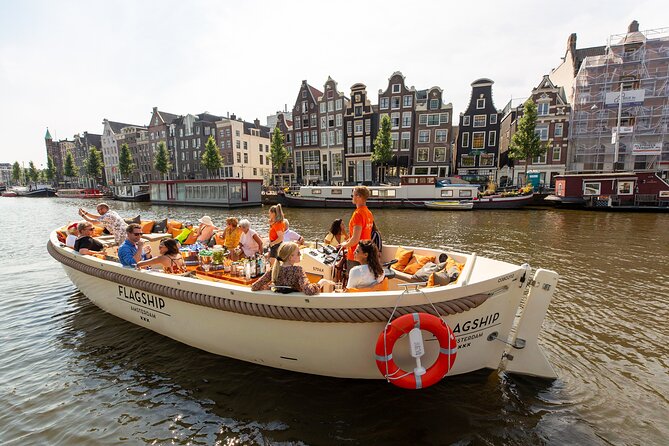 Amsterdam Luxury Canal Cruise + Unlimited Drinks & Bites option - Crew energy, orange-shirt stewards, and live commentary that actually guides