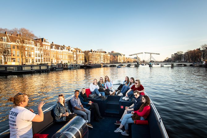 Amsterdam Open Boat Cruise with Live Guide and Two Drinks - Finding your way: Amstel 51F and the Hermitage departure