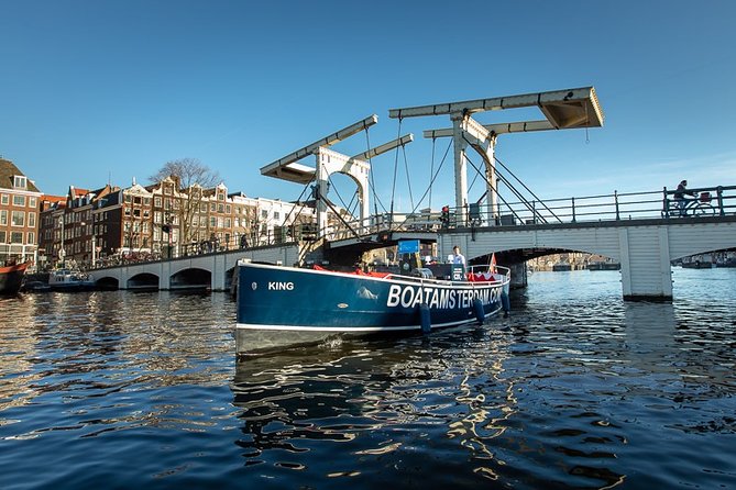 Amsterdam Open Boat Cruise with Live Guide and Two Drinks - Live guide storytelling: why the hour feels faster than it is