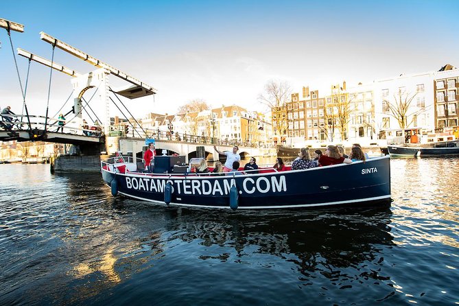 Amsterdam Open Boat Cruise with Live Guide and Two Drinks - Herengracht and Prinsengracht: canals you can almost name by vibe