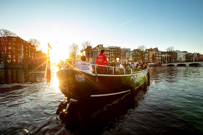 Amsterdam Open Boat Cruise with Live Guide and Two Drinks - The boat: open-air in good weather, heated seating when it’s cold