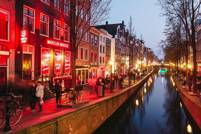 Amsterdam Red Light District Walking Tour in EN/DE/IT/ES - Amsterdam Centraal: legality, window-renting, and safety questions
