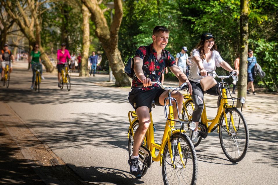 Amsterdam: Relaxed City Highlights Guided Bike Tour - The Skinny Love Bridge: Best Photo Stop and a Nice Rhythm Change