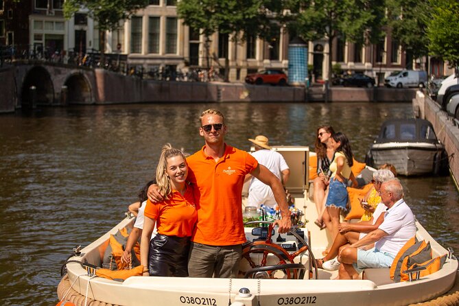 Amsterdam: Saloon Boat Cruise + Unlimited Drinks & Bite option - The boat itself: saloon comfort, steps, and how to dress for the canal wind