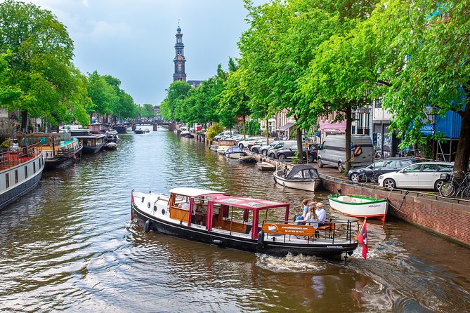 Amsterdam Small-Group Canal Cruise With Dutch Snacks and Drink - The water route: UNESCO canal belt, Jordaan, and Amstel views