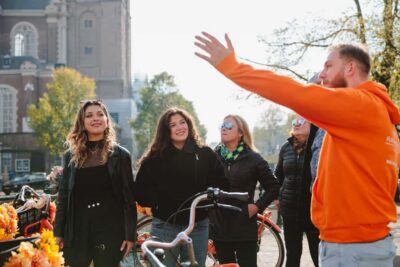 Amsterdam: Top Highlights Guided Bike Tour EN/DE/ES/FR/IT/CN - Meeting at Nieuwezijds Voorburgwal 101: easy to find, easy to start