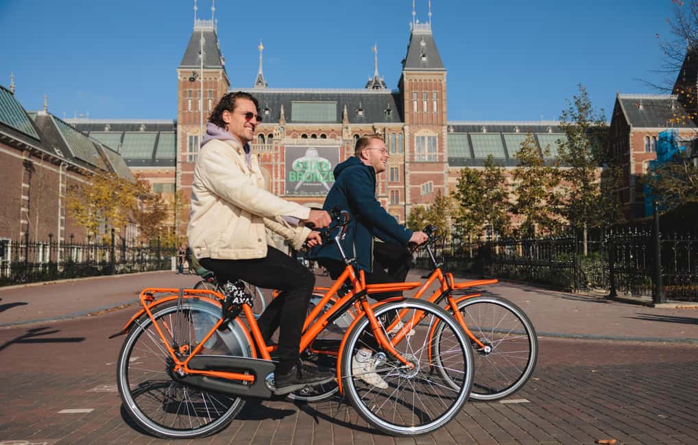 Amsterdam: Top Highlights Guided Bike Tour EN/DE/ES/FR/IT/CN - Red Light District pass-by, Leidse Square food, and a break in Vondelpark