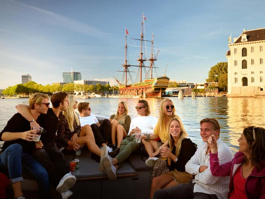 Amsterdam:1.5-Hour Canal Cruise local Guide, Drinks & Snacks - What You Get Onboard: Heineken, Wine, Soda, and Dutch Snack Time