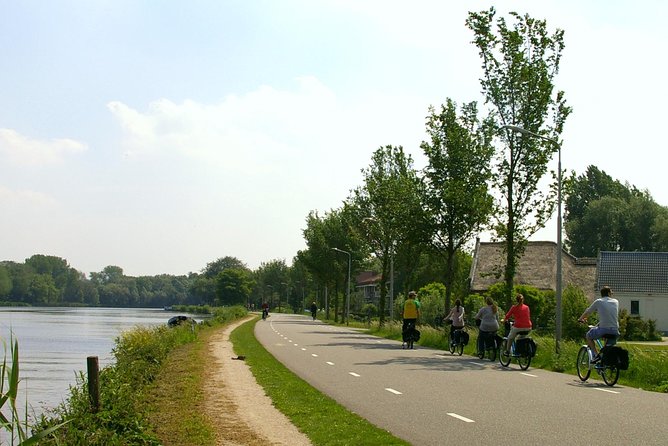 Countryside Bike Tour from Amsterdam: Cheese, Clogs & a Windmill - Returning to Amsterdam: A Final IJ Crossing and Local Tips