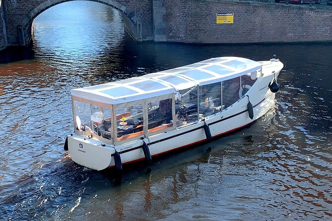 Dutch Cheese & Drinks Guided Amsterdam Boat Tour, All Inclusive - Setting off from Oudezijds Voorburgwal and the narrow 14th-century canals