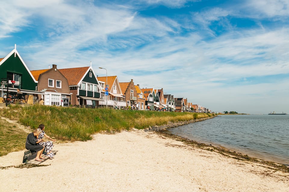 From Amsterdam: Zaanse Schans, Edam, & Marken Full-Day Trip - Marken Guided Tour: Wooden Houses, Quiet Harbor, and a Church Icon