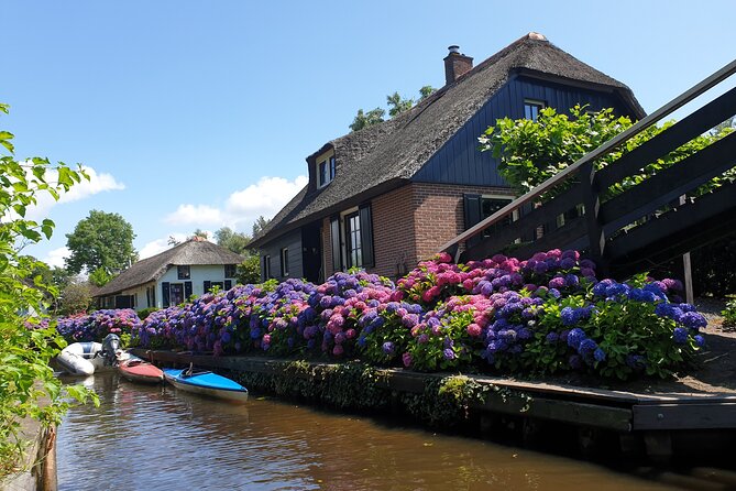 Giethoorn, Zaandam & Zaanse Schans Day Tour w/ Small Boat Ride - Getting out of Amsterdam: the van ride past IJsselmeer and the great dikes