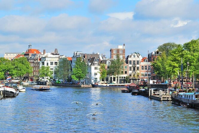Guided Amsterdam Canal Cruise – Snacks & Drinks on board(1 Hour) - Key highlights you’ll feel right away