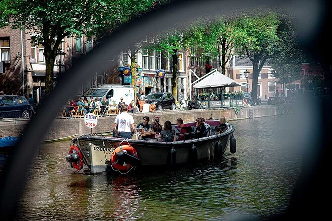 Guided Amsterdam Canal Cruise – Snacks & Drinks on board(1 Hour) - Stop 4 to 6: ship-shaped skyline views, memory-filled streets, and a 17th-century garden