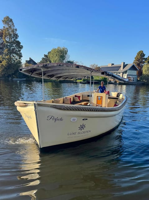 Haarlem: Guided Highlights Canal Cruise on Open Boat - The guide experience: stories that leave you with context, not facts alone