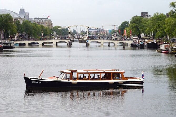 Morning Canal Cruise Amsterdam in Small-Group - The 1928 saloon boat: dry seating, warm blankets, and windows you’ll understand